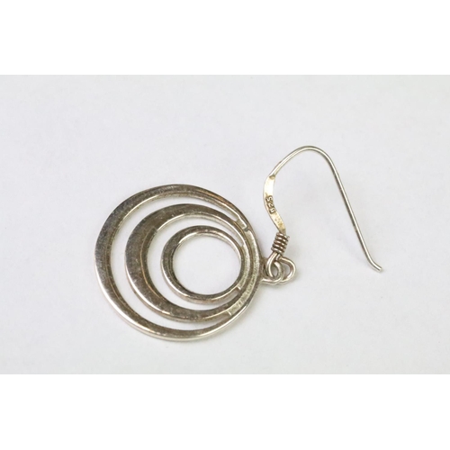 241 - A pair of sterling silver modernist drop earrings.