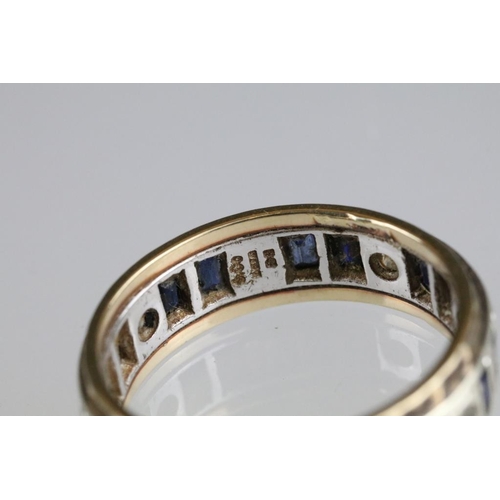 250A - Two 20th Century eternity rings to include one 9ct gold example set with blue and white stones (hall... 