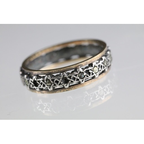 250A - Two 20th Century eternity rings to include one 9ct gold example set with blue and white stones (hall... 