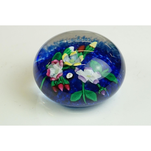 64 - Six glass paperweights to include a John Deacons faceted lamp work pansy & millefiori paperweight (w... 