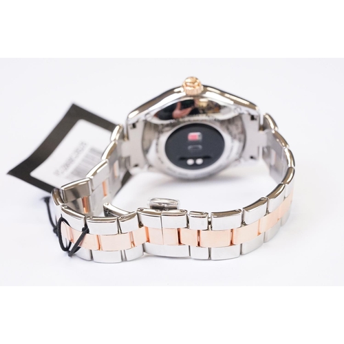 454 - A ladies Frederique Constant Geneve smart watch, bi metal case and strap with roman numeral markers,... 