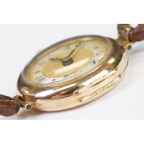 457 - A 1930's fully hallmarked ladies V.W.C. 9ct gold cased wristwatch with enamel and mother of pearl di... 