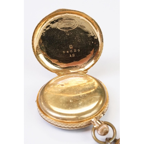 461 - An antique 18ct gold cased top winding fob watch, roman numeral markers with golden dial, clean cart... 