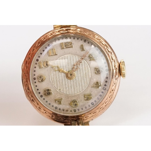 466 - A 1930's fully hallmarked ladies Marvin 9ct gold cased wristwatch with Silvered dial, mounted to bla... 