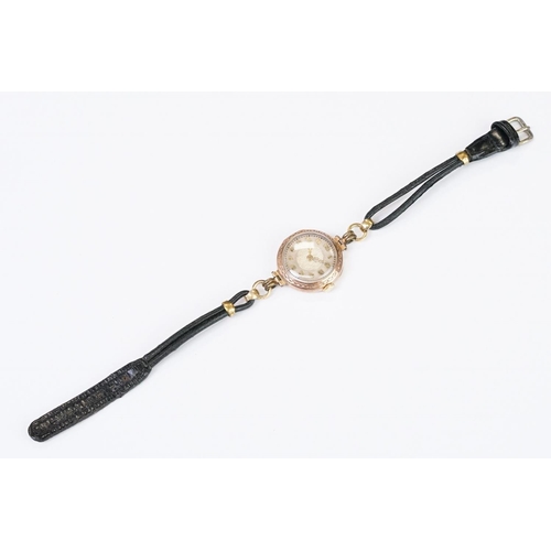 466 - A 1930's fully hallmarked ladies Marvin 9ct gold cased wristwatch with Silvered dial, mounted to bla... 