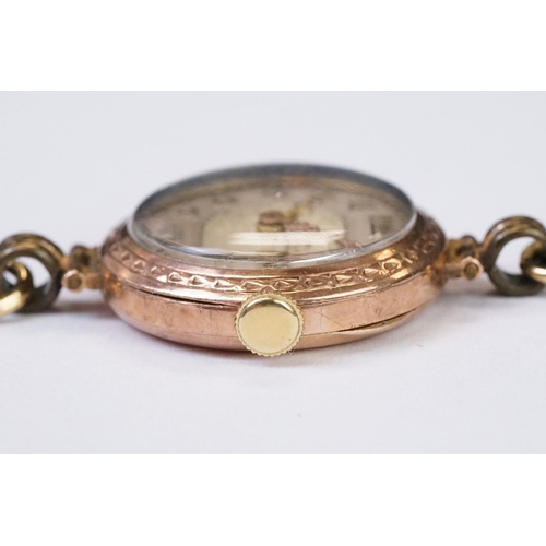 466 - A 1930's fully hallmarked ladies Marvin 9ct gold cased wristwatch with Silvered dial, mounted to bla... 