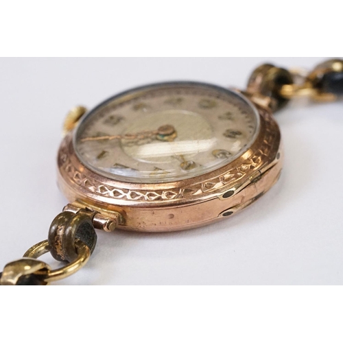 466 - A 1930's fully hallmarked ladies Marvin 9ct gold cased wristwatch with Silvered dial, mounted to bla... 