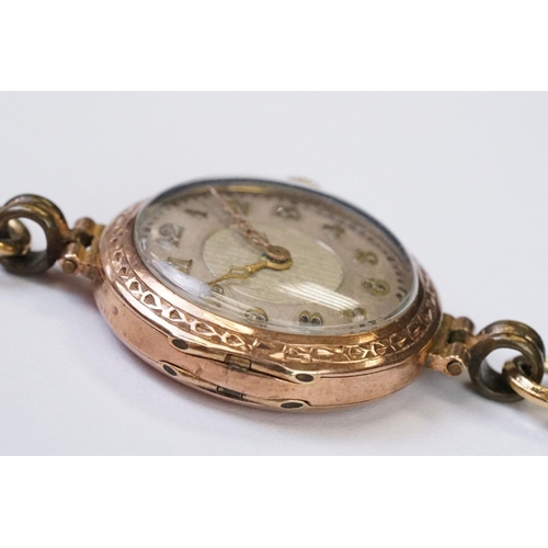 466 - A 1930's fully hallmarked ladies Marvin 9ct gold cased wristwatch with Silvered dial, mounted to bla... 