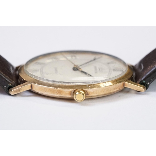 470 - A gents 9ct gold cased Marvin Quartz wristwatch, roman numeral markers with date function to 3 o'clo... 