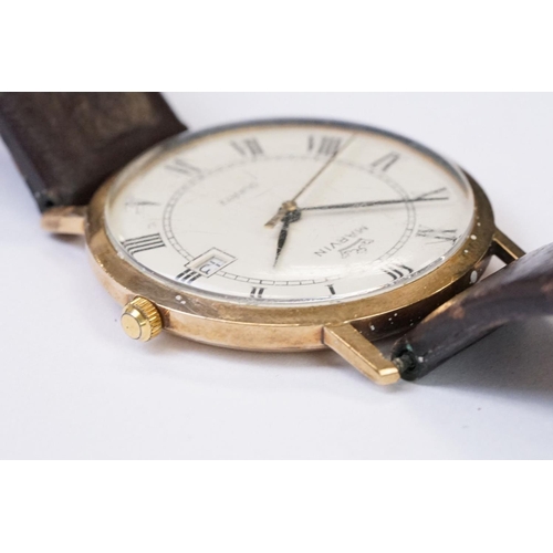 470 - A gents 9ct gold cased Marvin Quartz wristwatch, roman numeral markers with date function to 3 o'clo... 