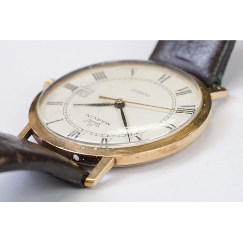 470 - A gents 9ct gold cased Marvin Quartz wristwatch, roman numeral markers with date function to 3 o'clo... 