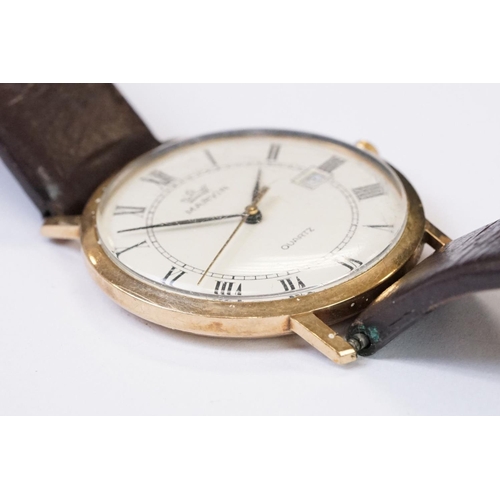 470 - A gents 9ct gold cased Marvin Quartz wristwatch, roman numeral markers with date function to 3 o'clo... 