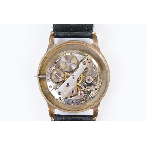 474 - A gents 9ct gold cased Garrard mechanical wristwatch, sub second dial to 6 o'clock, mounted to black... 