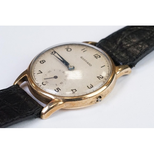 474 - A gents 9ct gold cased Garrard mechanical wristwatch, sub second dial to 6 o'clock, mounted to black... 