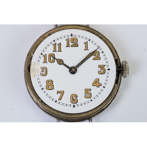 483 - An early 20th century military style trench watch, white enamel dial with numerical hour markers, mo... 