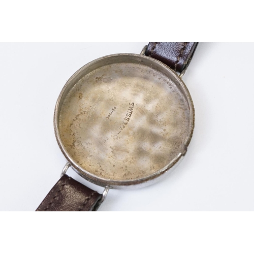 483 - An early 20th century military style trench watch, white enamel dial with numerical hour markers, mo... 