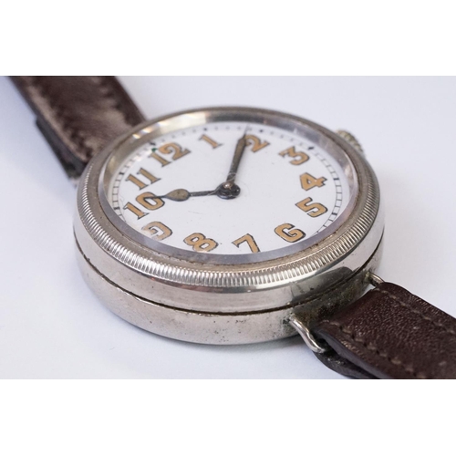 483 - An early 20th century military style trench watch, white enamel dial with numerical hour markers, mo... 