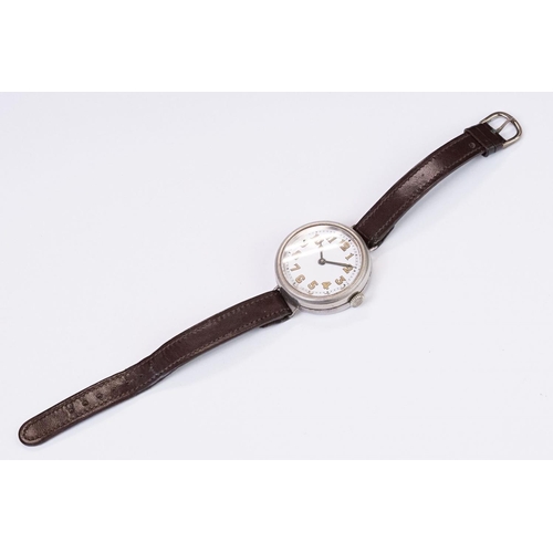 483 - An early 20th century military style trench watch, white enamel dial with numerical hour markers, mo... 