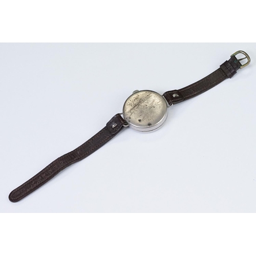 483 - An early 20th century military style trench watch, white enamel dial with numerical hour markers, mo... 