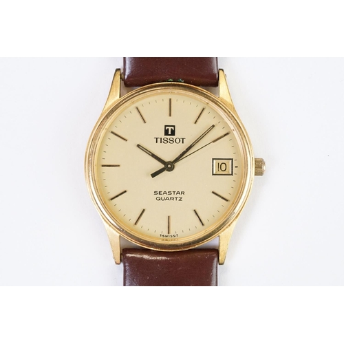 484 - A Tissot Seastar quartz wristwatch, baton markers with date function to 3 o'clock, mounted to brown ... 