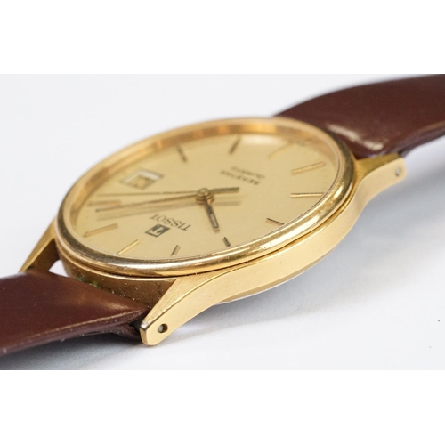 484 - A Tissot Seastar quartz wristwatch, baton markers with date function to 3 o'clock, mounted to brown ... 