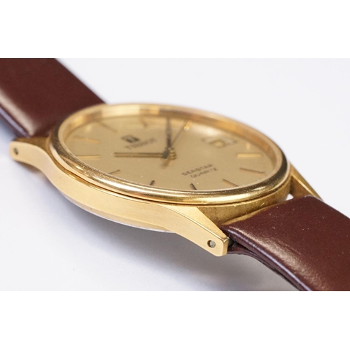 484 - A Tissot Seastar quartz wristwatch, baton markers with date function to 3 o'clock, mounted to brown ... 