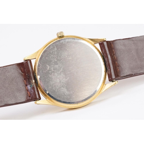 484 - A Tissot Seastar quartz wristwatch, baton markers with date function to 3 o'clock, mounted to brown ... 