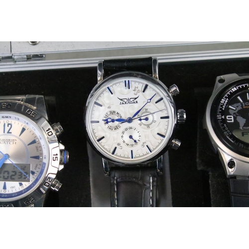 421 - A collection of ten contemporary automatic and quartz wristwatches contained within a display case t... 