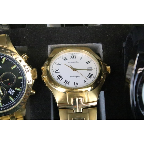 421 - A collection of ten contemporary automatic and quartz wristwatches contained within a display case t... 