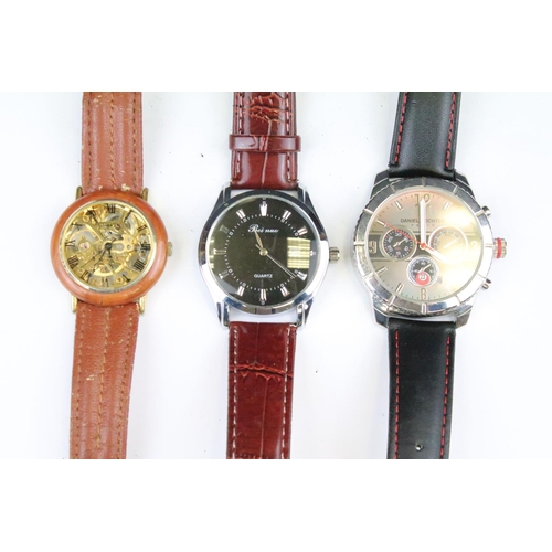 426 - A collection of thirteen contemporary automatic and quartz wristwatches to include a Daniel Hechter ... 