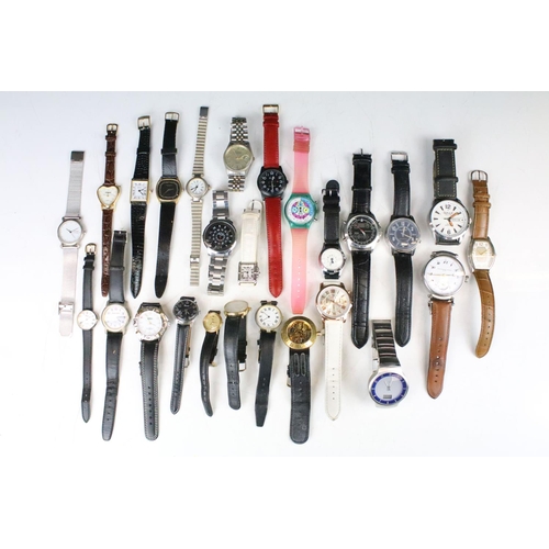 434 - A collection of twenty five mainly contemporary quartz ladies and gents wristwatches to include anal... 