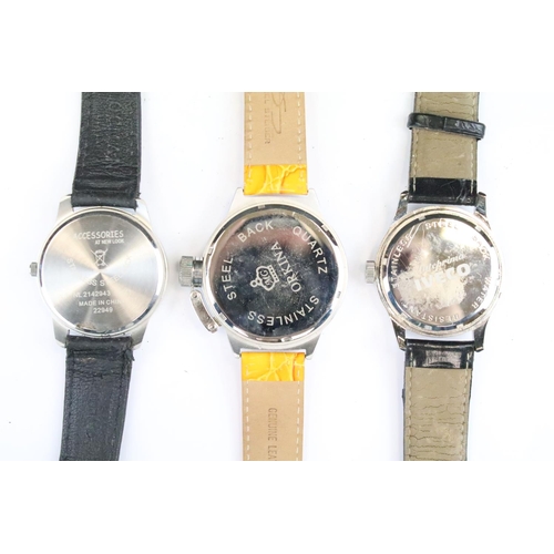 435 - A collection of twenty five mainly contemporary quartz ladies and gents wristwatches to include anal... 