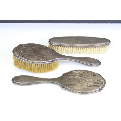 558 - Collection of early 20th Century silver vanity dressing table items to include a yellow guilloche en... 