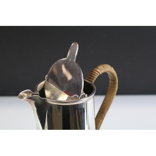 560 - Early 20th Century silver hallmarked coffee pot having moulded rim with wicker handle (hallmarked Bi... 