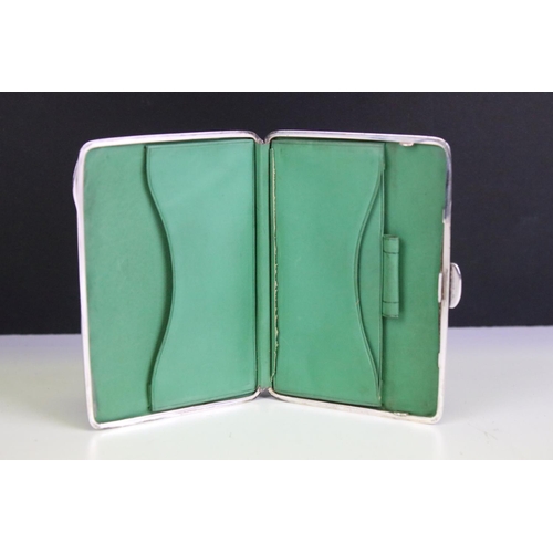 569 - Early 20th Century silver hallmarked wallet with green leatherette interior (hallmarked Birmingham 1... 