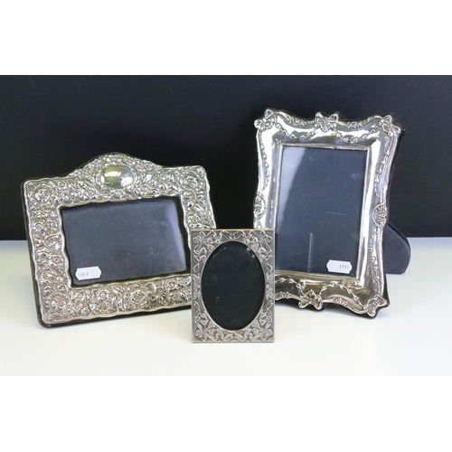 572 - Three photo frames to include a silver fronted frame with bow garland detailing (hallmarked London 1... 