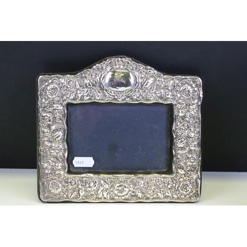 572 - Three photo frames to include a silver fronted frame with bow garland detailing (hallmarked London 1... 