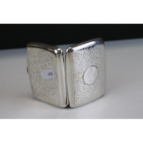 641 - George V silver cigarette case of curved rectangular form, with engraved scrolling Acanthus leaf dec... 