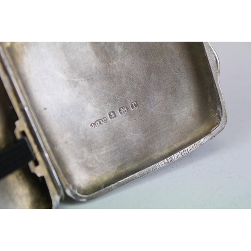 641 - George V silver cigarette case of curved rectangular form, with engraved scrolling Acanthus leaf dec... 