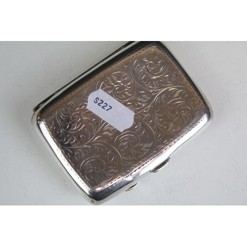 641 - George V silver cigarette case of curved rectangular form, with engraved scrolling Acanthus leaf dec... 