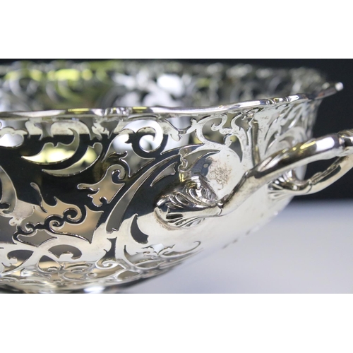 649 - Early 20th Century silver hallmarked twin handled basket with pierced foliate details throughout and... 