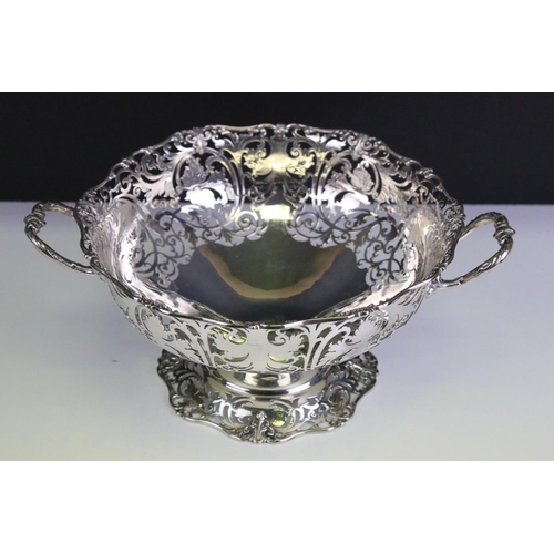 649 - Early 20th Century silver hallmarked twin handled basket with pierced foliate details throughout and... 