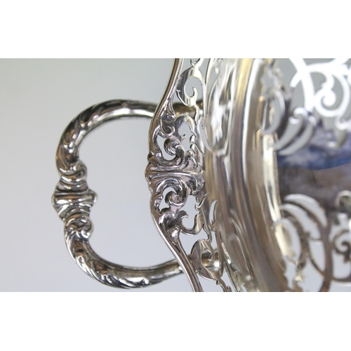 649 - Early 20th Century silver hallmarked twin handled basket with pierced foliate details throughout and... 