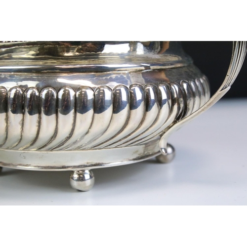 650 - George IV silver hallmarked twin handled sugar bowl having a reeded body with foliate moulded handle... 