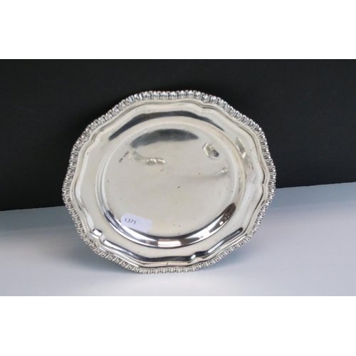 651 - Mid Century silver plate with a moulded gadrooned rim (import marked London 1972), together with a s... 