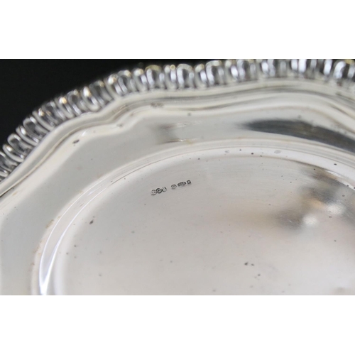 651 - Mid Century silver plate with a moulded gadrooned rim (import marked London 1972), together with a s... 