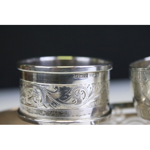 652 - Five silver hallmarked napkin rings to include a pair of engine turned examples (hallmarked Birmingh... 