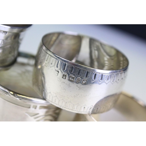 652 - Five silver hallmarked napkin rings to include a pair of engine turned examples (hallmarked Birmingh... 