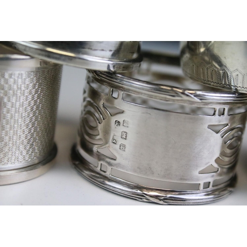 652 - Five silver hallmarked napkin rings to include a pair of engine turned examples (hallmarked Birmingh... 