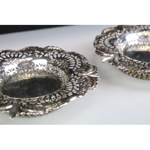 655 - Pair of Victorian silver hallmarked pin dishes each having pierced rims with moulded floral details.... 